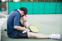 small-vecteezy_sad-tennis-player-sitting-in-the-court-after-lose-a-match_10120682_small